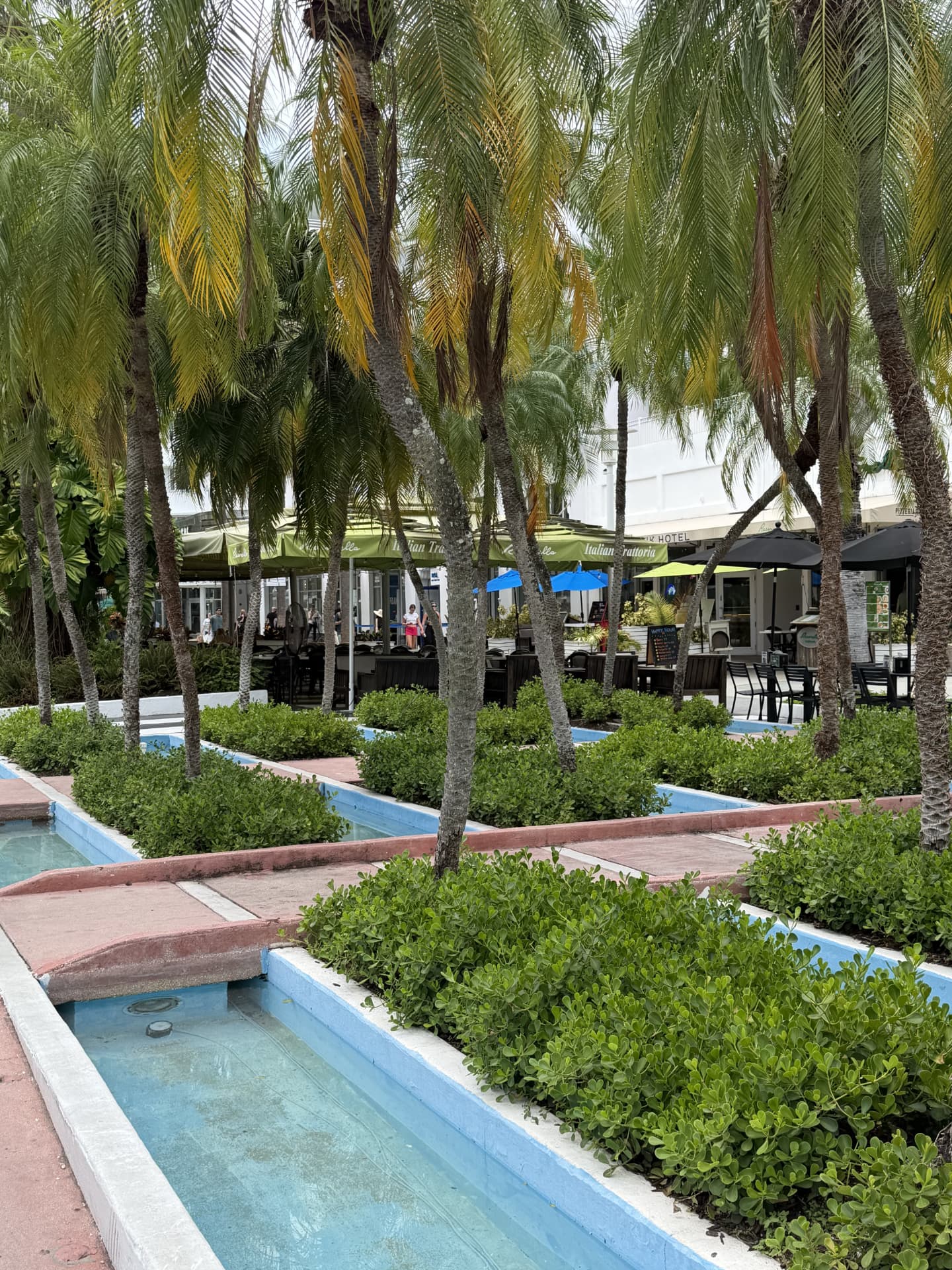 Palm trees, water features and outdoor dining along Lincoln Road, Miami Beach